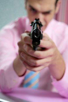 Businessman point his handgun to camera, wallpaper background