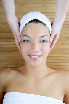 Head massage over bamboo, beautiful blue eyes woman