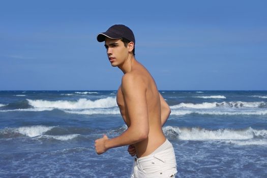 Handsome young man on the blue ocean beach summer sea