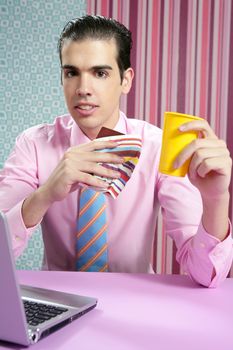 Businessman young eating fast food menu at office with laptop