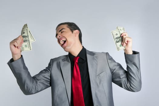 Businessman young with dollar notes suit and tie on gray background