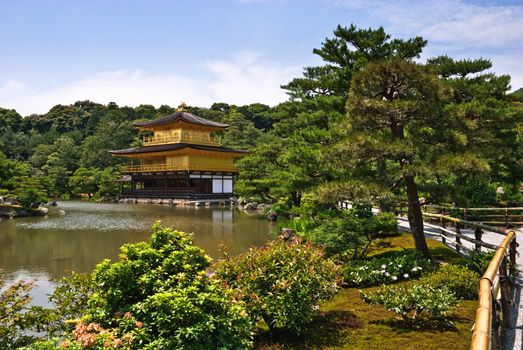 Kinkaku-ji temple, in Kyoto, Japan. The top two stories of the pavilion are covered with pure gold leaf.