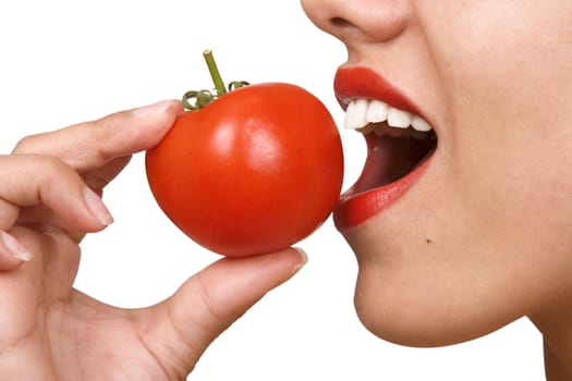 Young Woman Eating Tomatoes. Portrait of smiling attractive young woman with ripe tomato, white background, freshness and healthy food concept