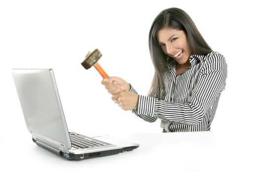 Angry brunette businesswoman with hammer against screen