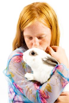 Sweet girl with rabbit isolated on white