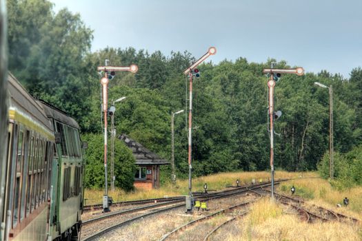 View from the window of a train passing the railway station
