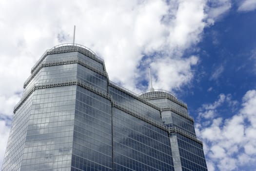 A large glass building with two spires