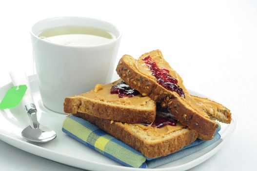 Toast, peanut butter and Jam with a cup of tea.