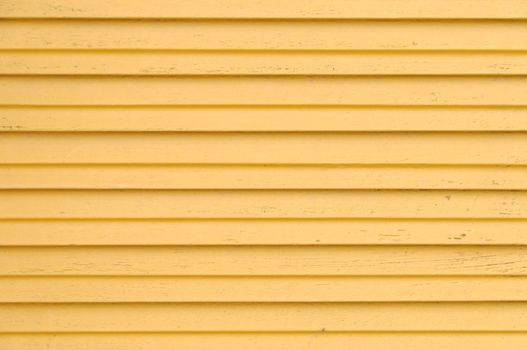 closeup detail of wooden yellow blinds - horizontal shot