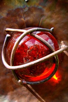 red glass ball in cupper