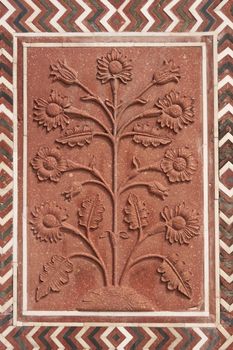 Detail of decoration on the mosque at the Taj Mahal. Mughal style building of red sandstone inlaid with marble. Agra, Uttar Pradesh, India