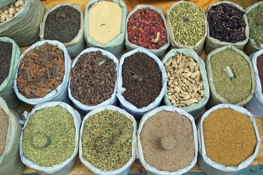Colorful arrangement of spices for sale at a market stall in Old delhi, India