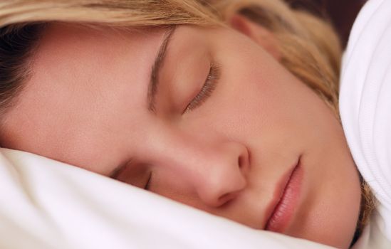 Closeup image of a beautiful young woman sleeping peacefully