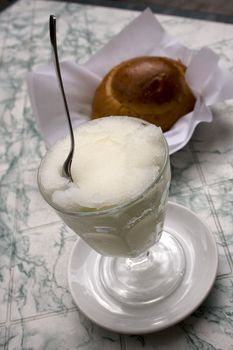 Granita and brioches, a typical sicilian dessert of water and lemon ice
