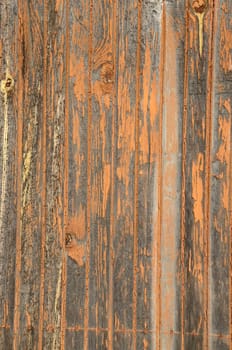 Paint stripped off old factory door. Wooden background textures.