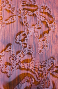 wood after the rain with raindrops in sunlight