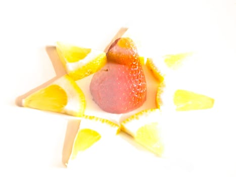 triangles of lemon with a strawberry on transparency while being eaten
