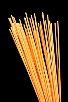 Spaghetti on black background