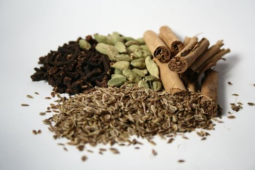 Assorted spices on white tablecloth
