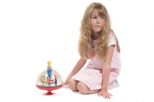 Shot of little girl playing with toy in studio