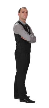 Young confident businessman standing up against a white background.