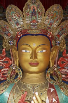 Head of a golden Buddha inside a temple at Thikse monastery. Ladakh, India