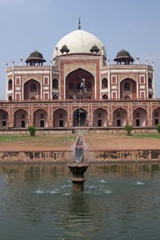 Humayun's Tomb. Islamic mausoleum. Large red sandstone building decorated with inlaid white marble. Delhi India