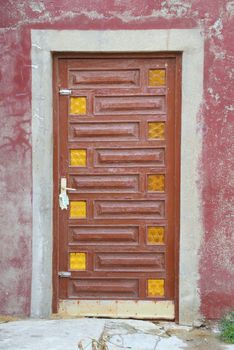 An old colored door. Photographed up close.