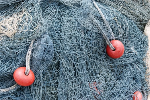 Fishing net bluish color. With red balls.