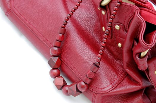 red beads and woman's bag isolated on the white background