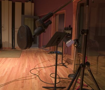 Black microphone in a large recording studio