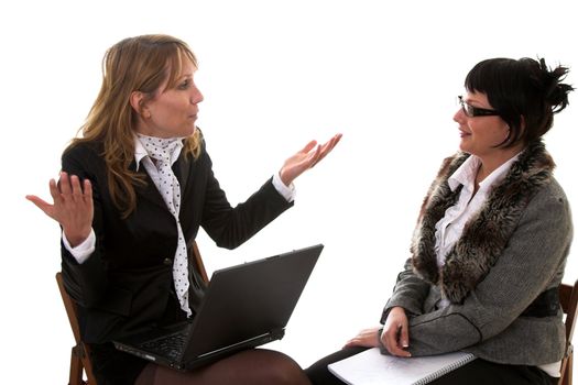 Two business women having a lively discussion on white background