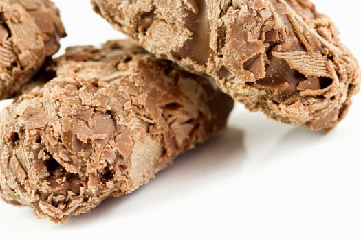 Delicious chocolate truffels on white background