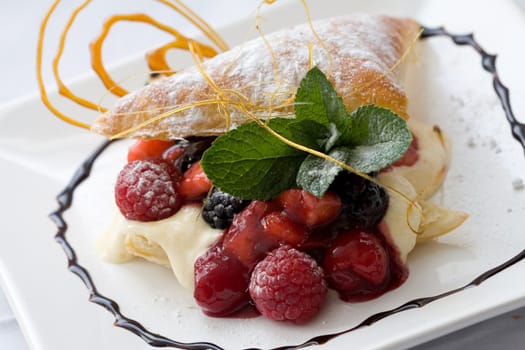  Delicious pastry dessert filled with fruit on a decorated plate