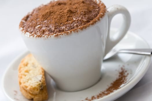 Small chocolate dessert served in a small coffee cup