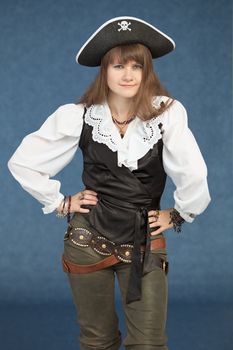 Pirate woman in hat standing on blue background