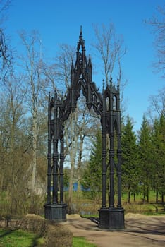 Beautiful gothic iron gate in Pushkin park. Russia, Saint-Petersburg.