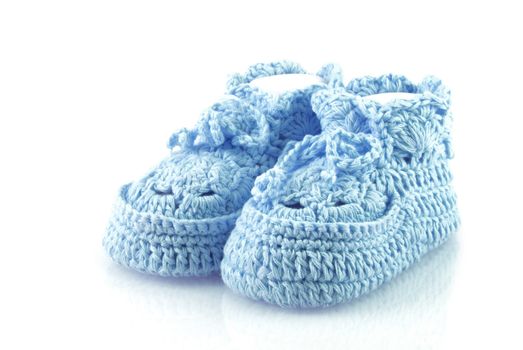 Cute blue baby footwear on a white background.