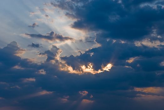 Sunbeam shining through the dark clouds