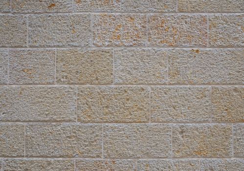 Decorative wall paved with natural sandstone light yellowish color