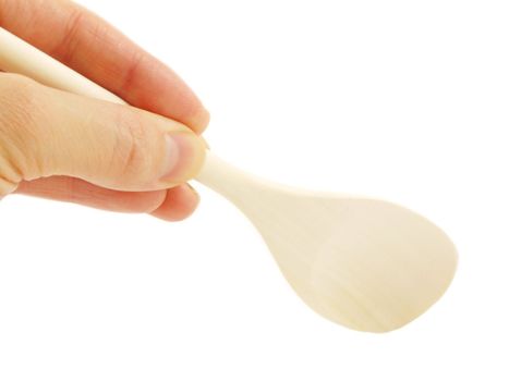Person holding a wooden spatula, isolated towards white background