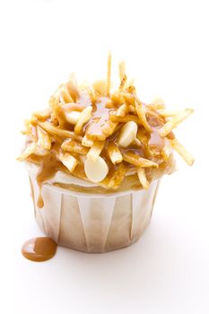 cupcake in a white paper cup decorated to look like a poutine
