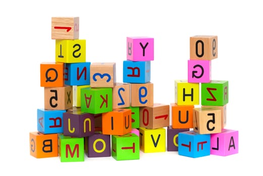Wooden blocks with letters and numbers on white background