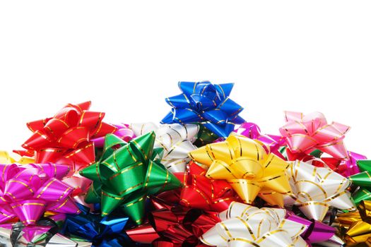 Heap of the colorful decorative bows isolated over white background