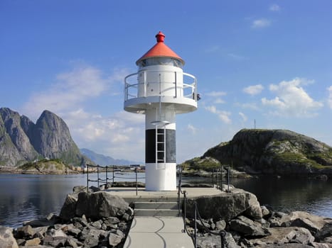 Red and white Lofoten lighthouse in norwegian sea, Norway