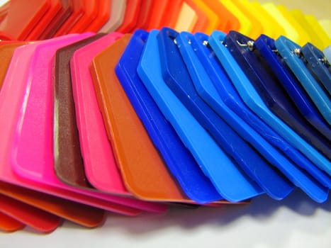 plastic color samples , pink red blue yellow
