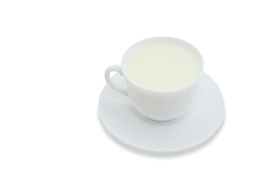 Mug with the milk, standing on a saucer on a white background. With clipping path.