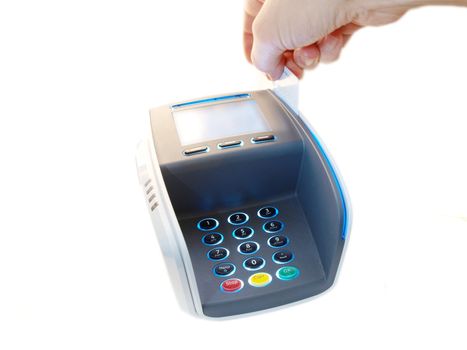 Someone paying with a magnet card, on a payment terminal