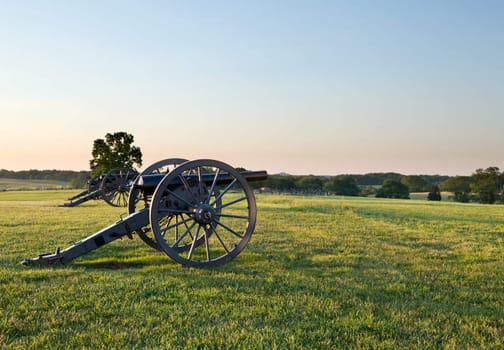 Sunset view of the old cannons in a line at Manassas Civil War battlefield where the Bull Run battle was fought. 2011 is the sesquicentennial of the battle