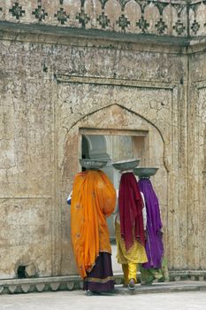 Female labourers working to restore Amber Fort in Jaipur, Rajasthan, India